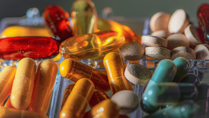 A bunch of supplements in different colors.