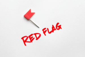 A red flag sign with a small red flag.