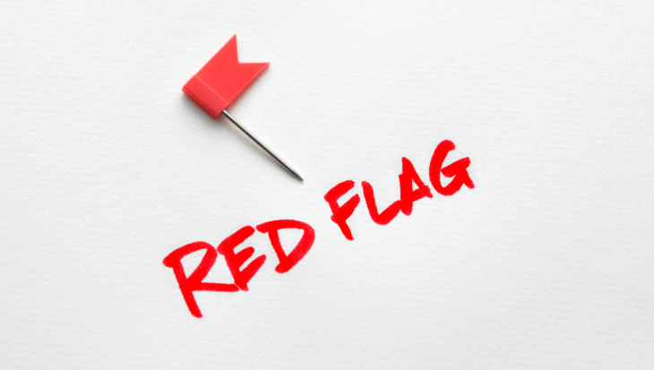 A red flag sign with a small red flag.