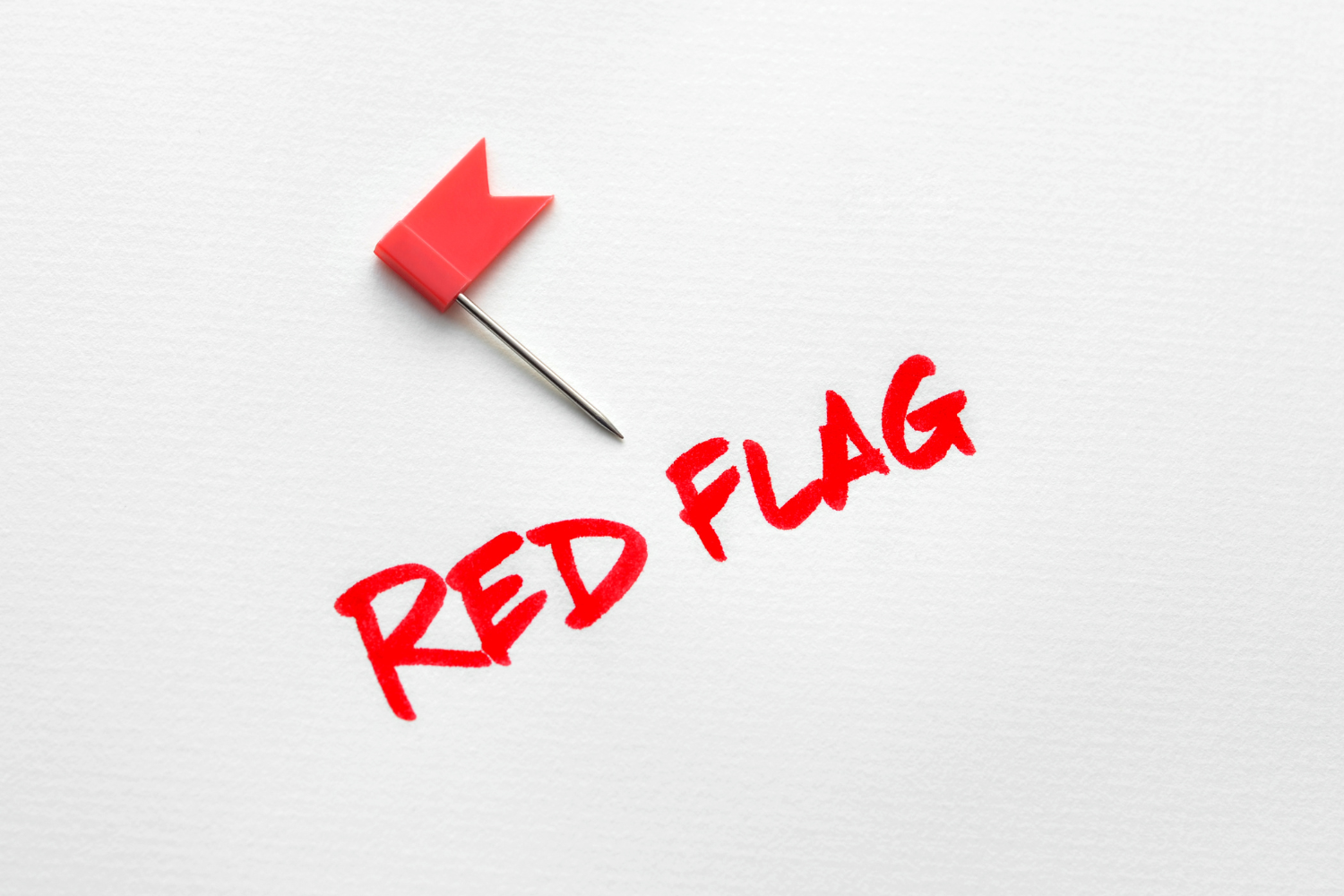 A red flag sign with a small red flag.