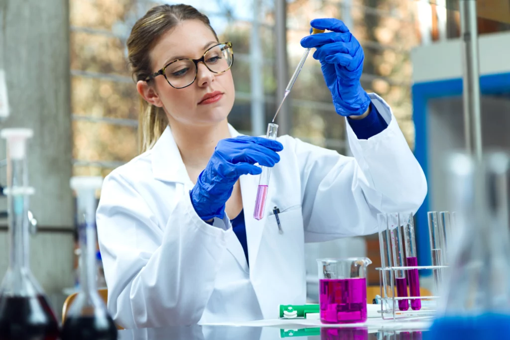 A professional showcasing various high-quality supplement ingredients in a lab setting to ensure safety and effectiveness.