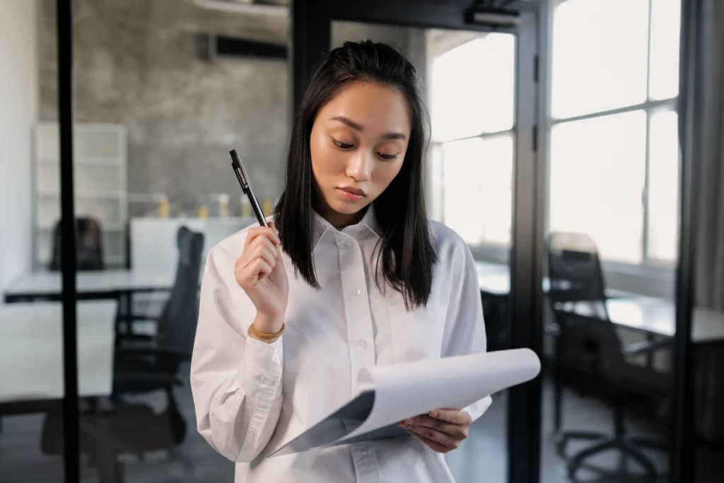 A professional holding a clipboard with a checklist.