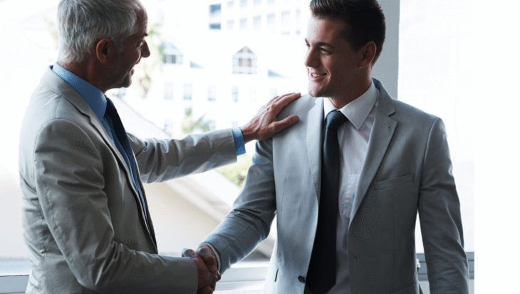 Two business professionals shaking hands.