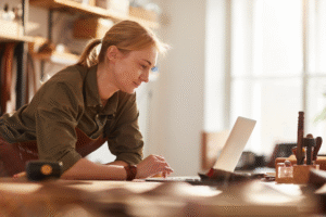 A business owner looking at something on her laptop.