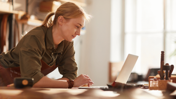 A business owner looking at something on her laptop.