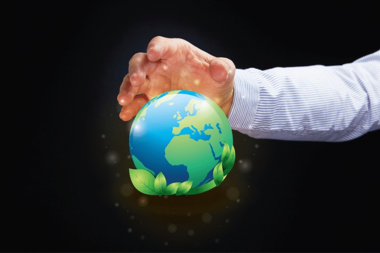 Person holding a visual of the earth.