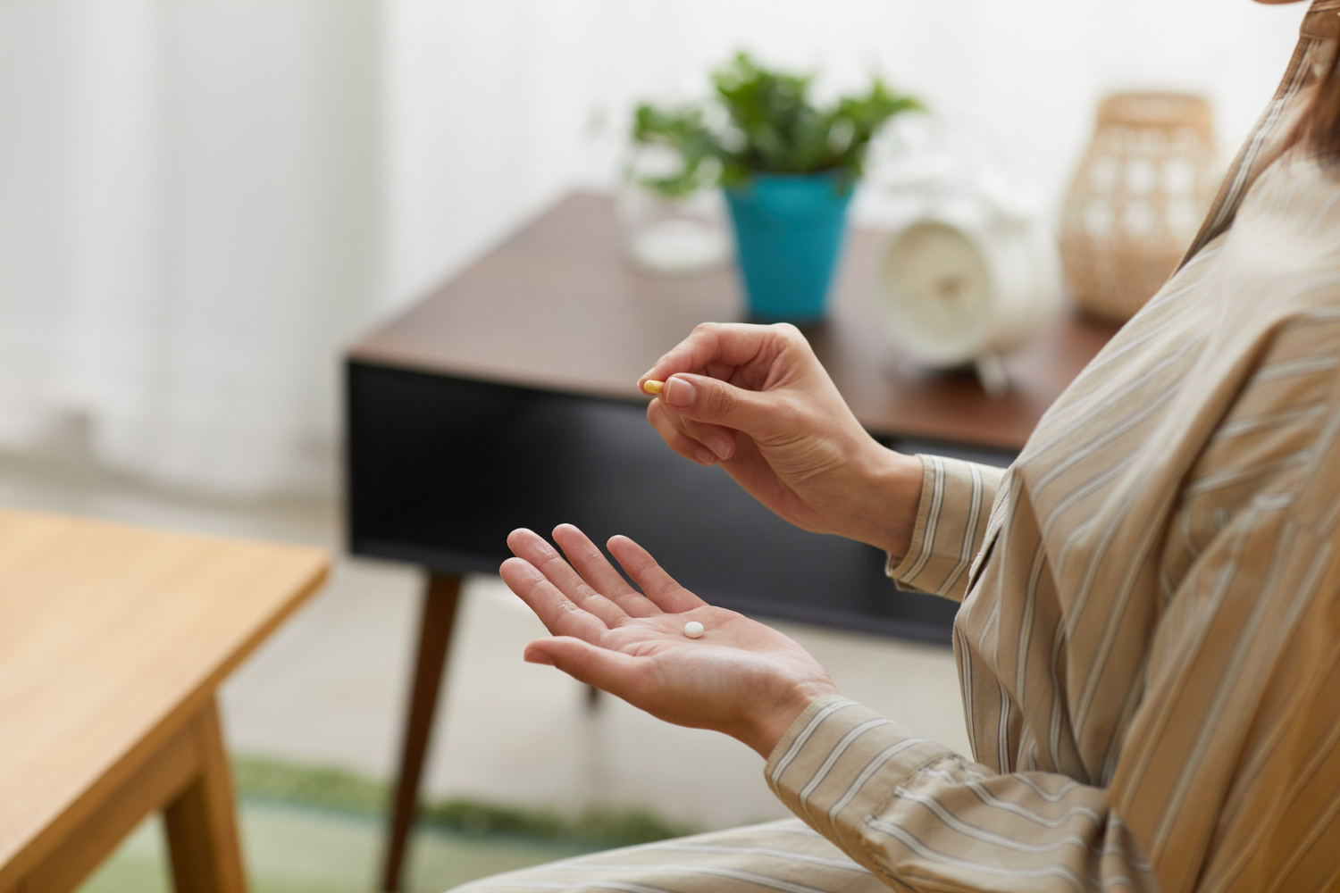 Person holding supplements.