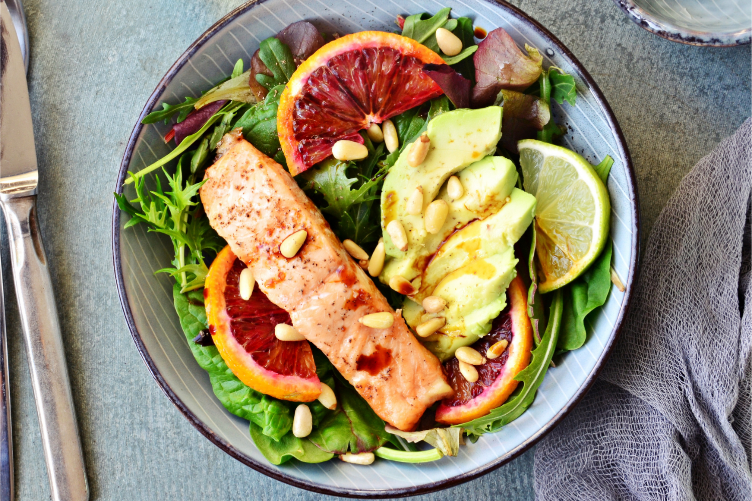 A plated meal featuring salmon and avocado.