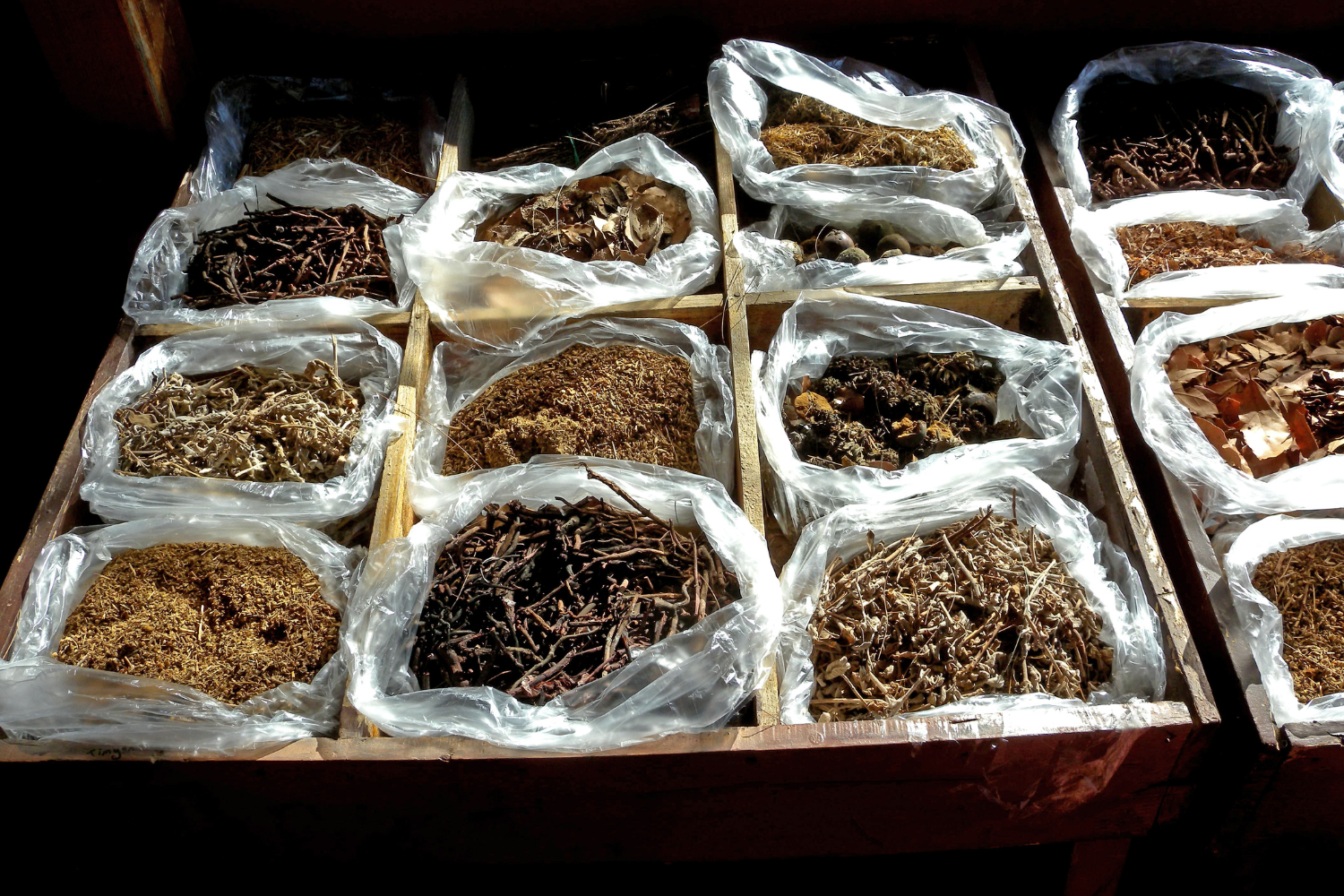 A selection of raw materials such as herbs, minerals, and powders.