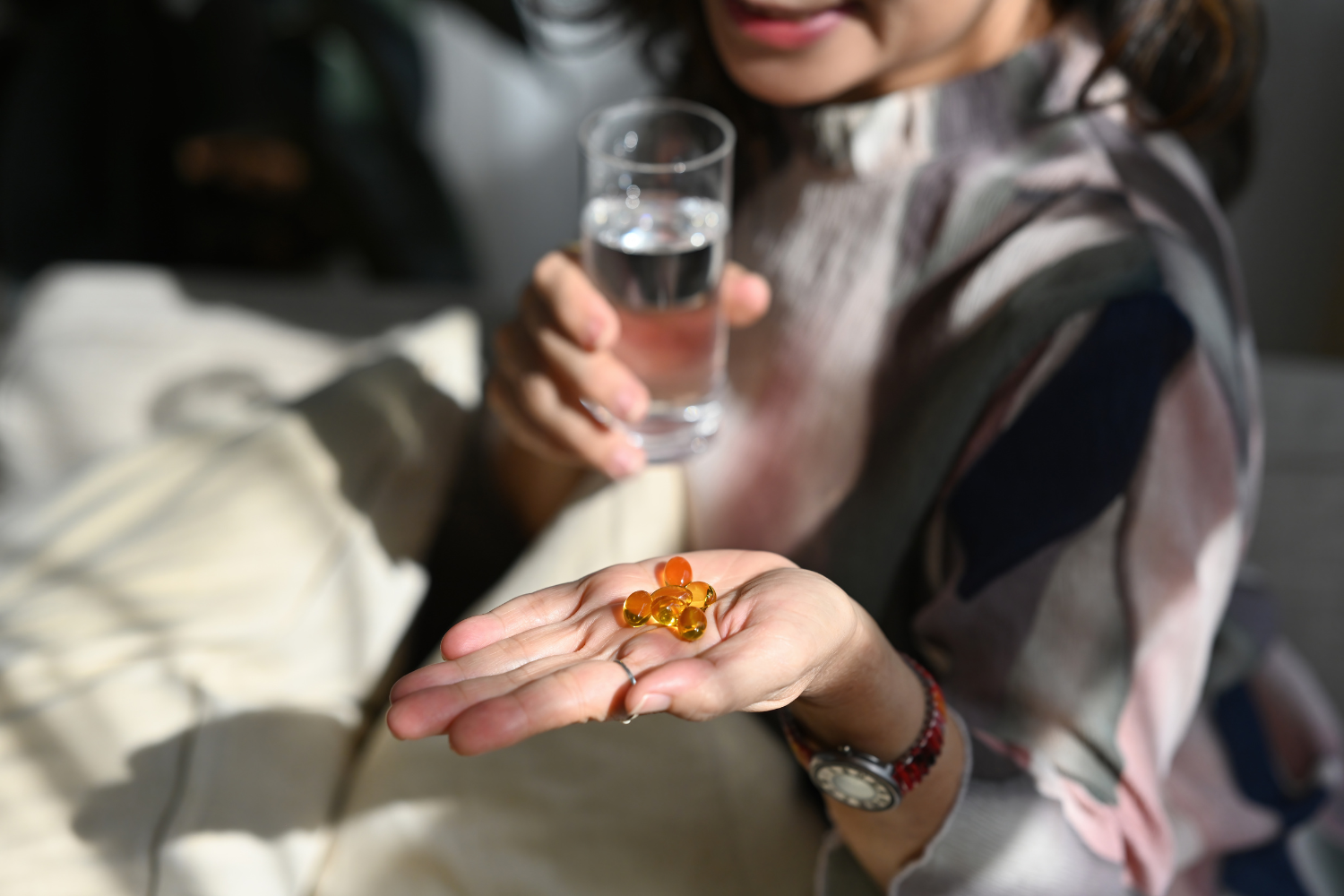 Person holding supplements.