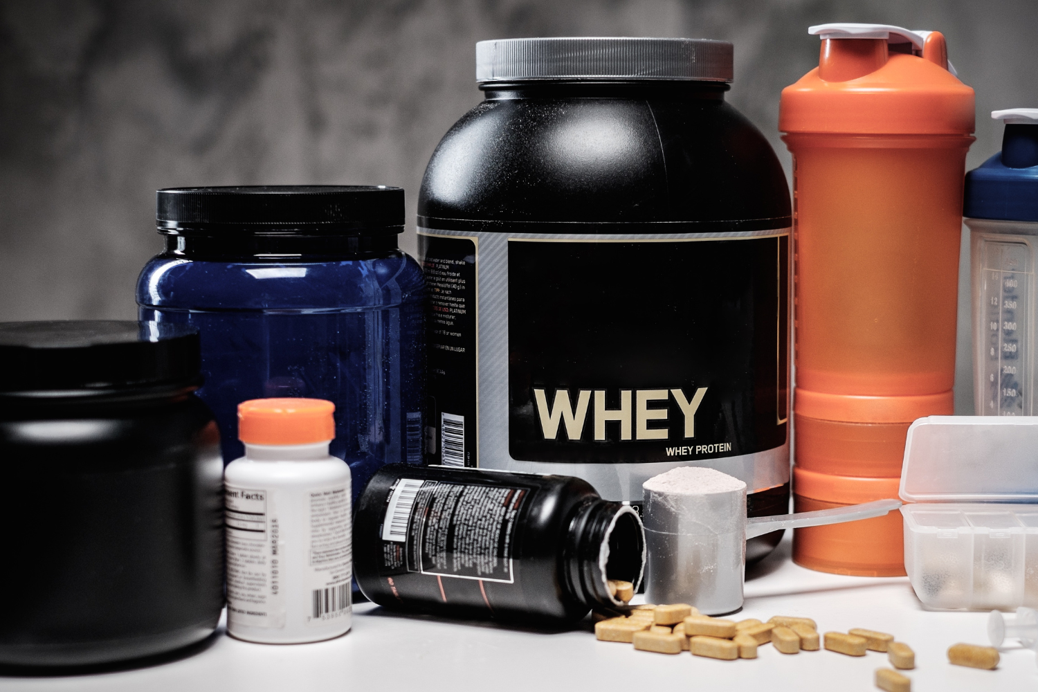 Range of sports nutrition products, including protein powders, pre-workout supplements, and recovery drinks.