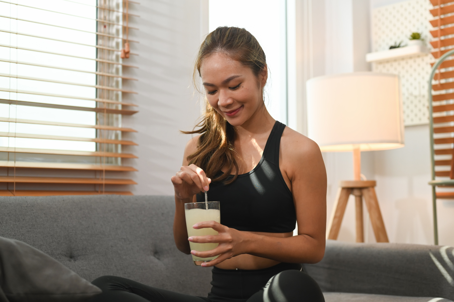 Woman drinking collagen powder.
