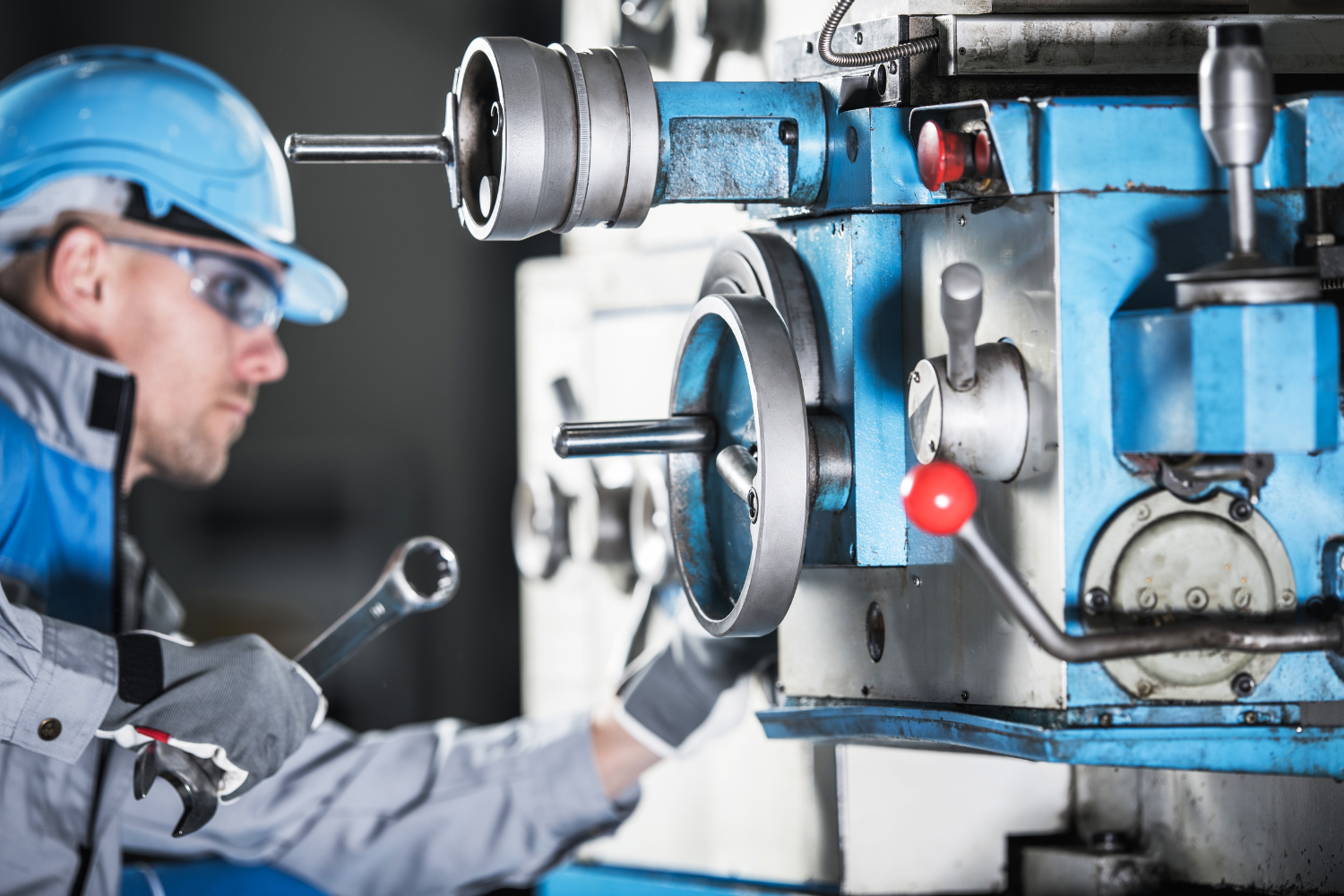 A technician calibrating a piece of manufacturing equipment.