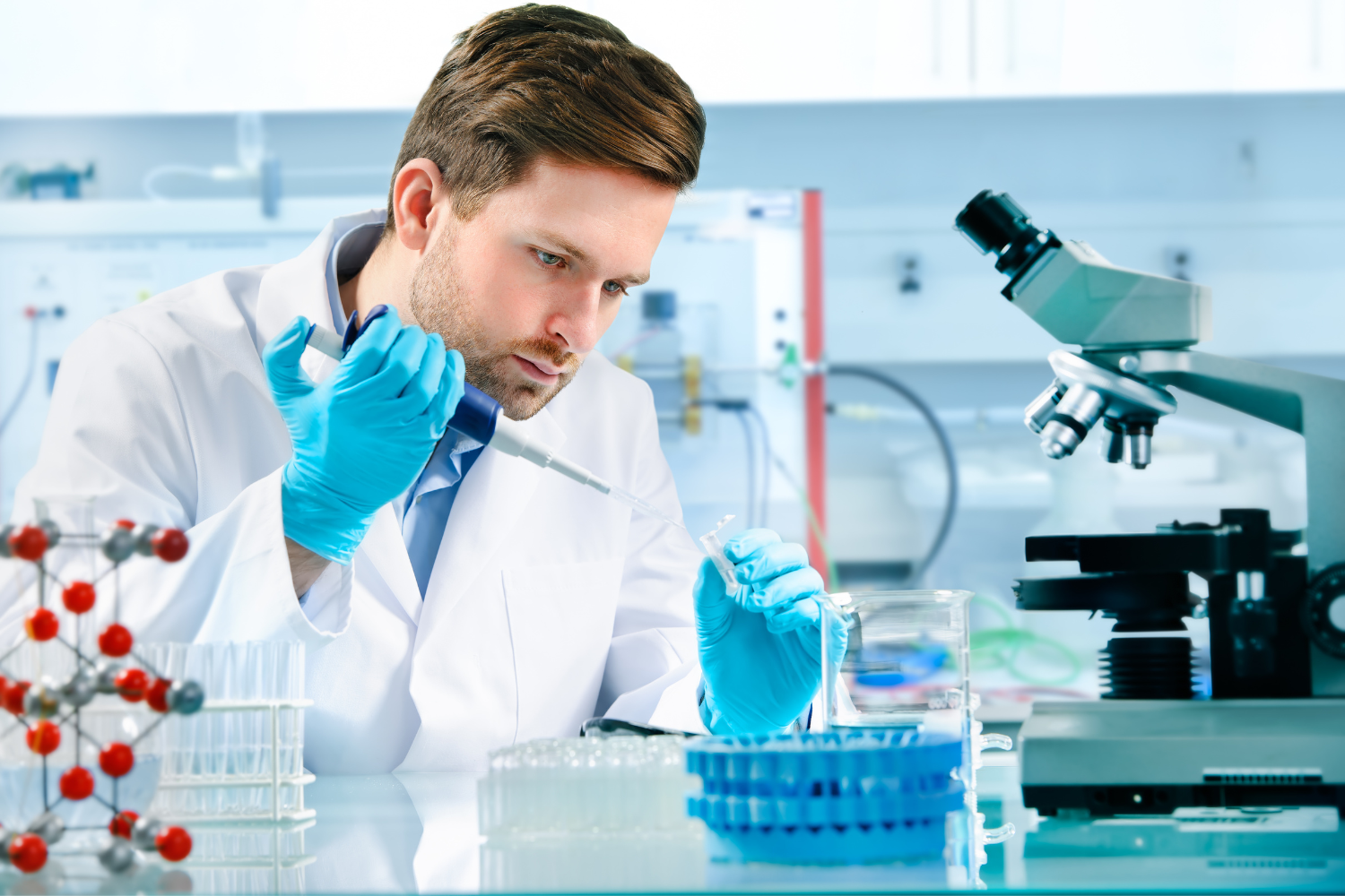 A laboratory technician using advanced equipment.