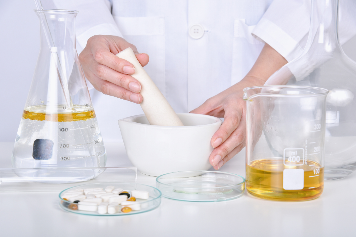 A scientist mixing supplement ingredients in a laboratory setting.
