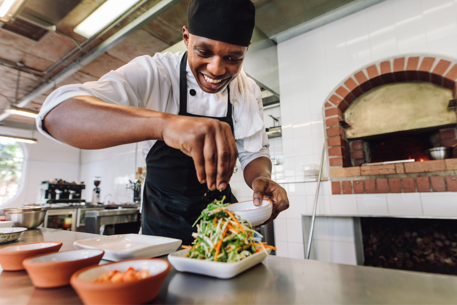 A chef preparing a halal-certified meal with fresh vegetables.