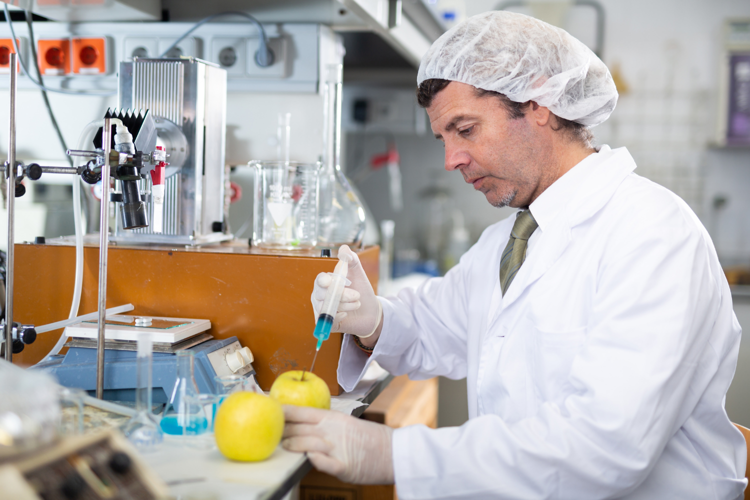 Scientist in a lab working on GMO fruits.