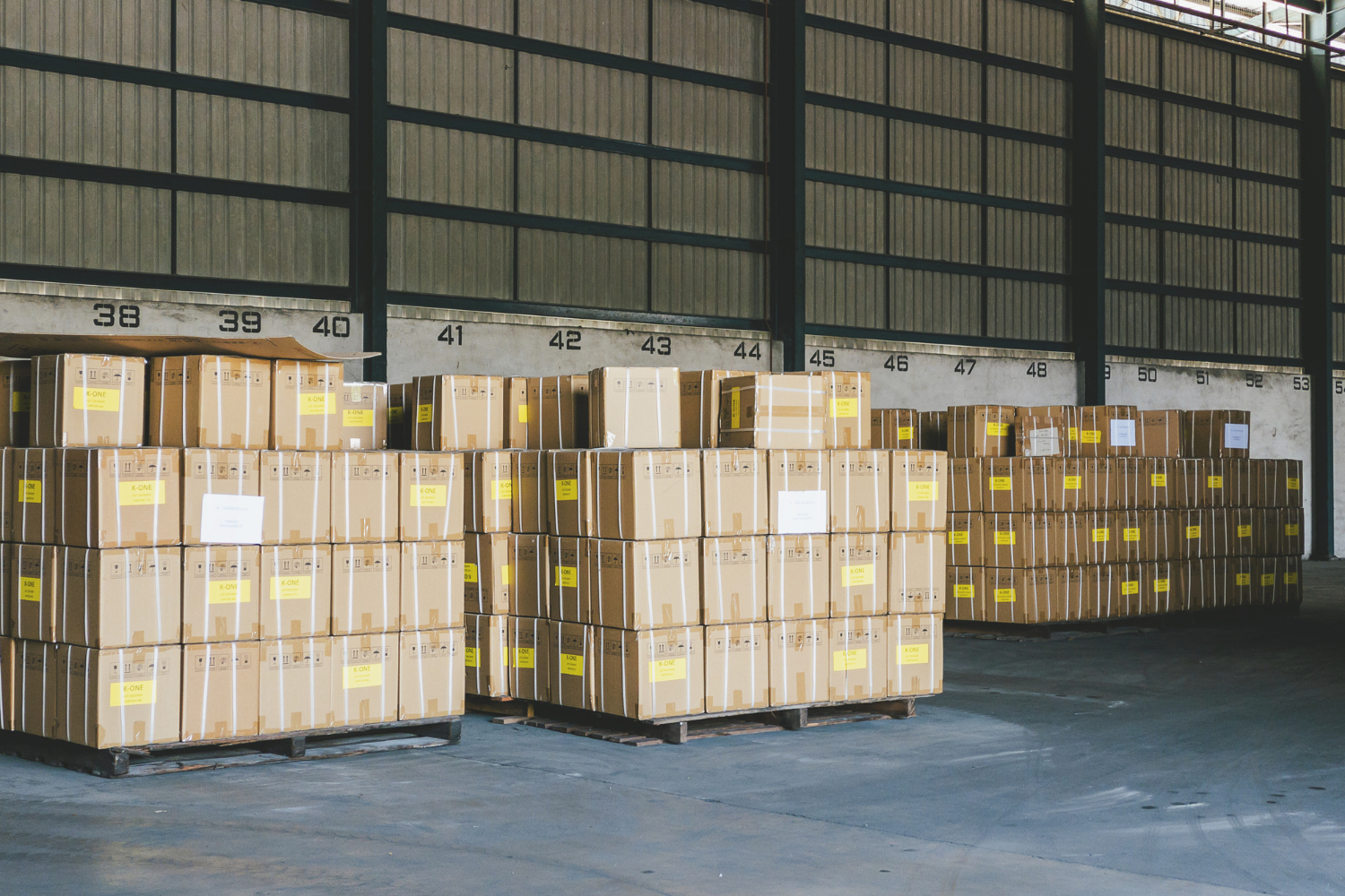 Stacks of boxes in a facility.