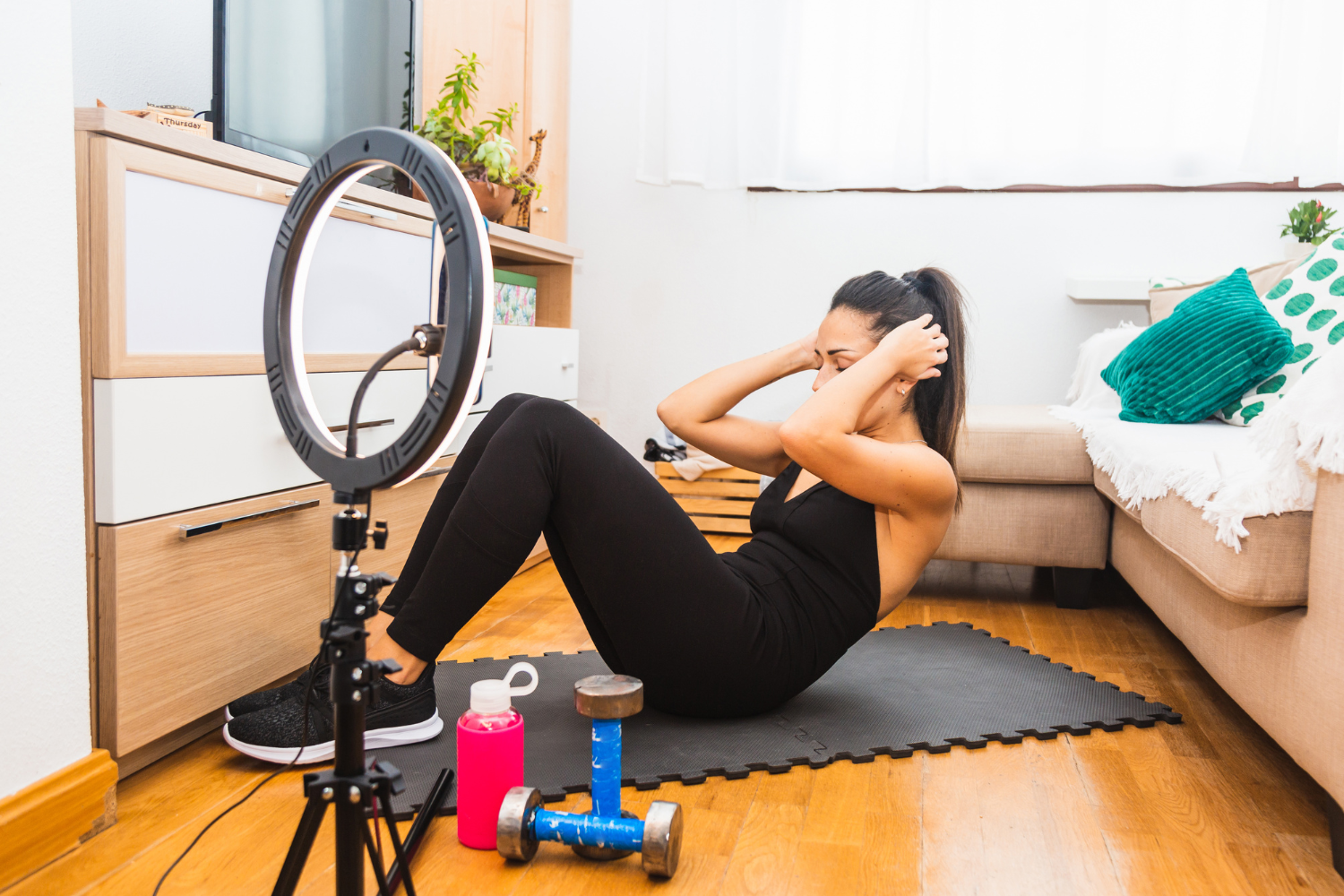 Fitness influencer in front of a camera.