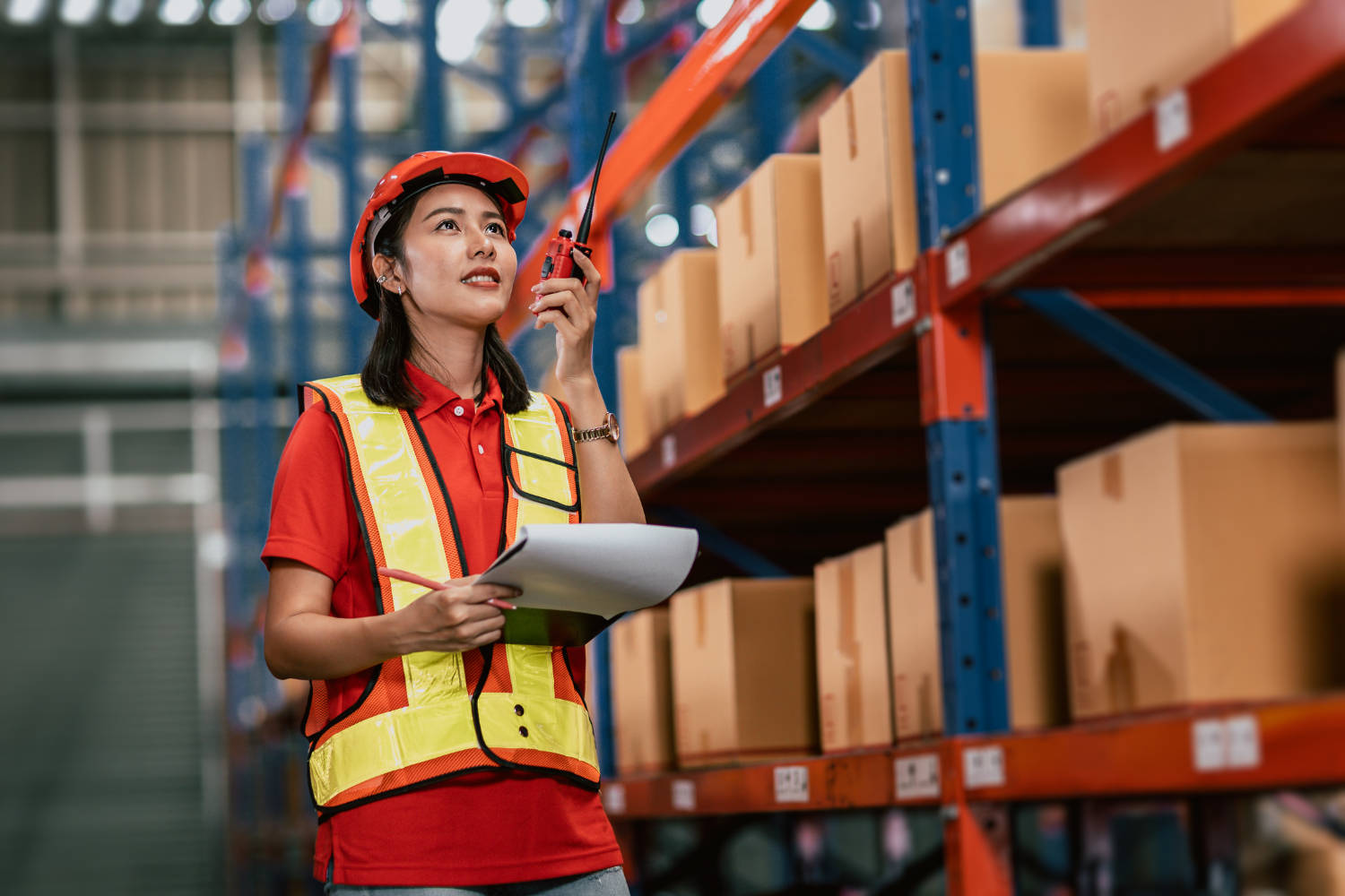 Shipment facility with a facility worker and boxes.