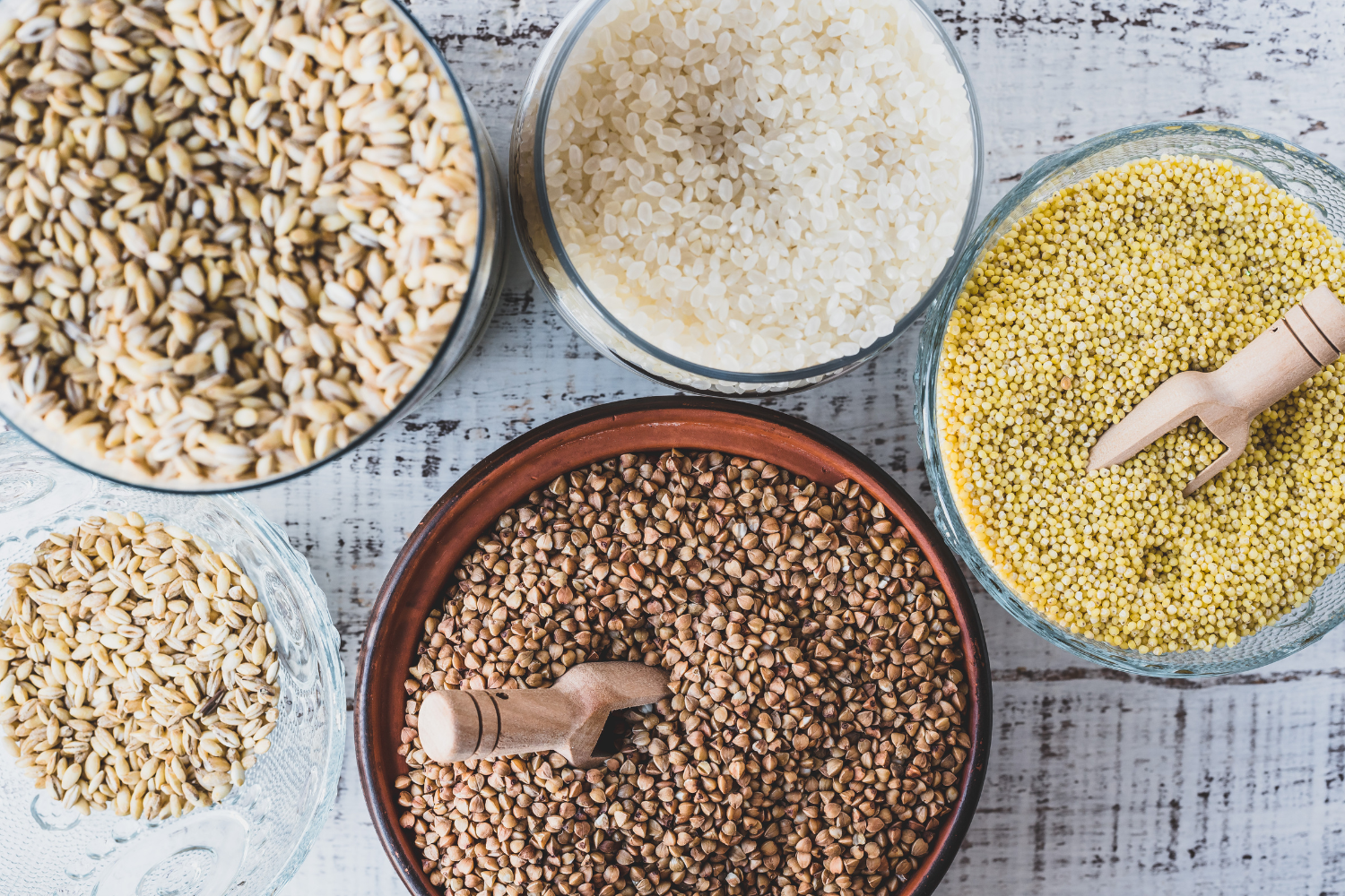 A collection of gluten-free ingredients such as rice, corn, and quinoa.