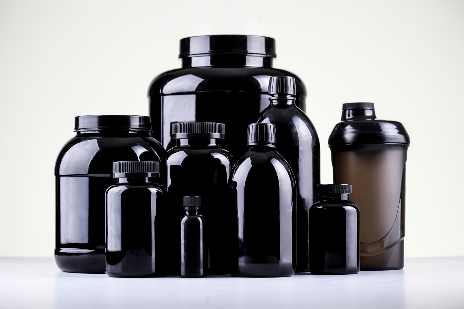 Series of blank supplement bottles.