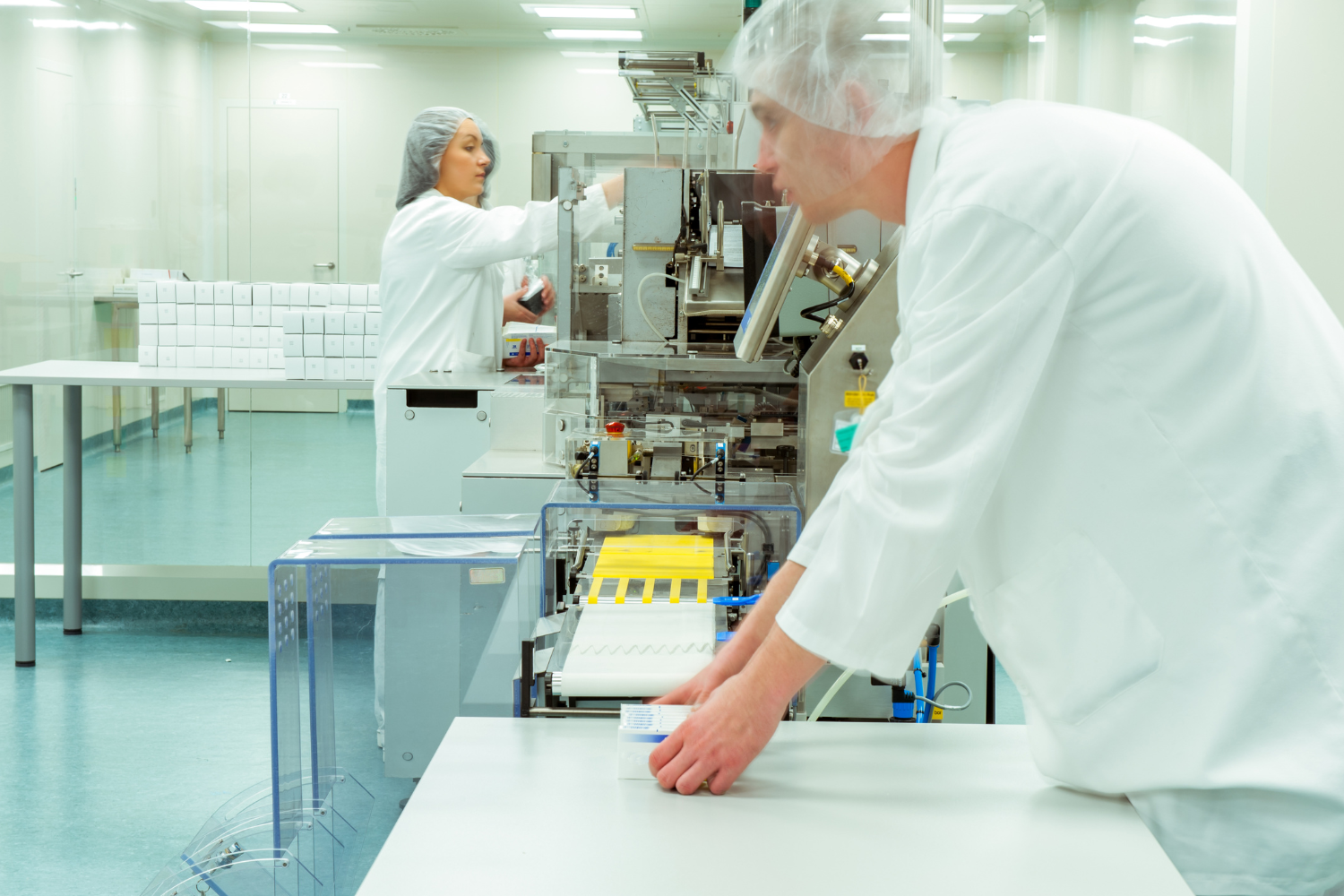 A modern supplement manufacturing facility with workers.