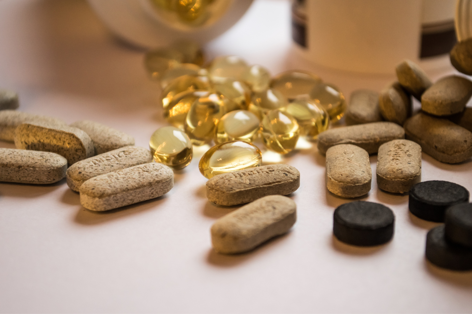 Multiple supplements on a flat surface.