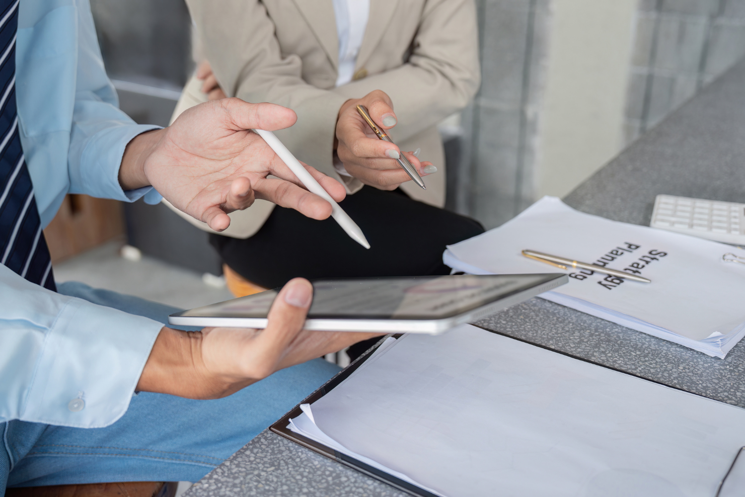 Business owners looking at a tablet.