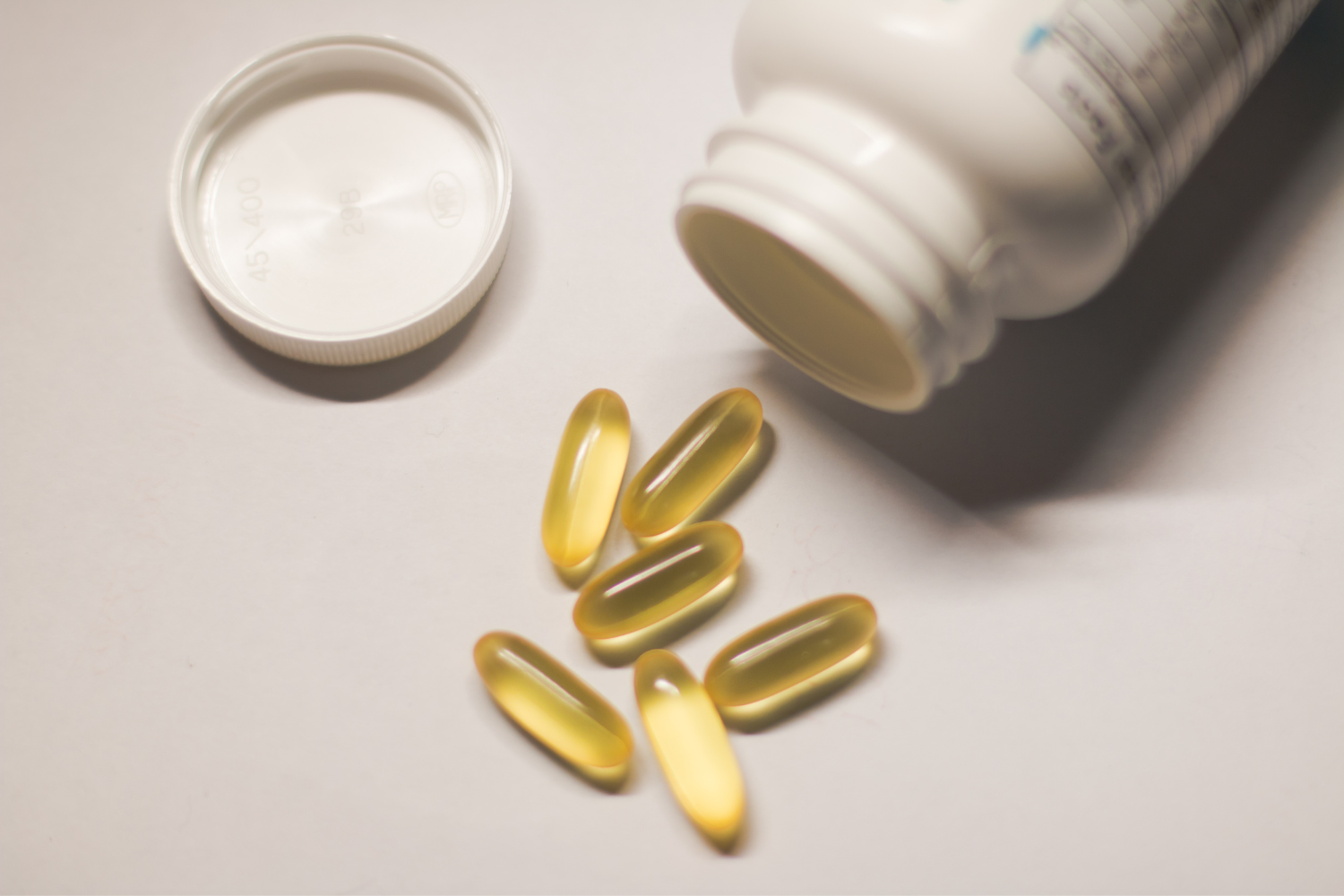 Supplements spilling from bottle.