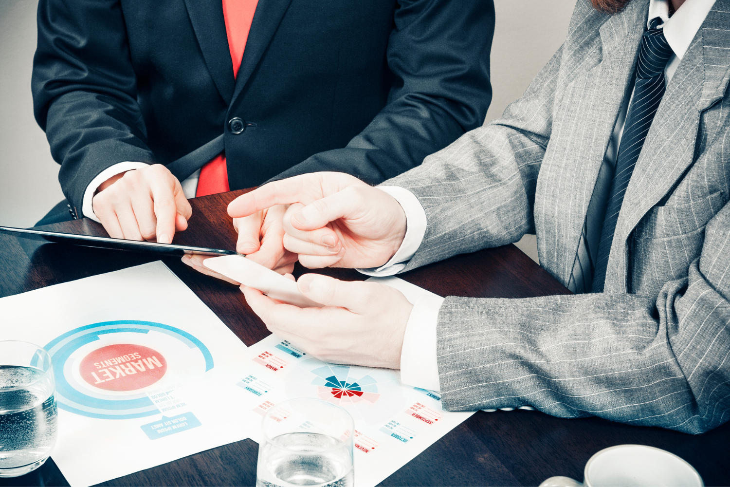 A team of professionals analyzing market segmentation data.