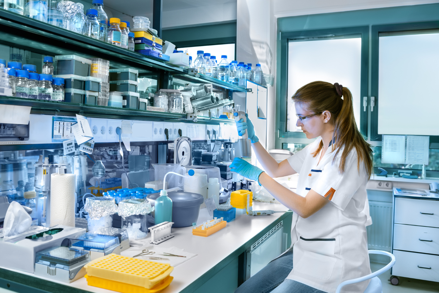 Laboratory setting with a scientist creating custom vitamin blends.