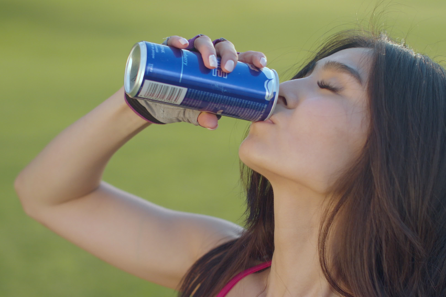 Woman drinking electrolyte drinks.