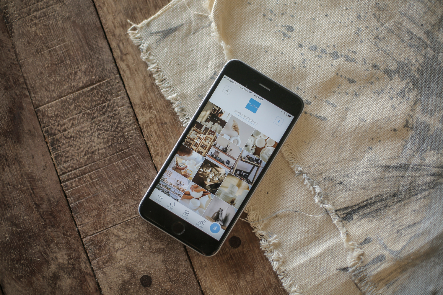 Smartphone with images on a social media platform.