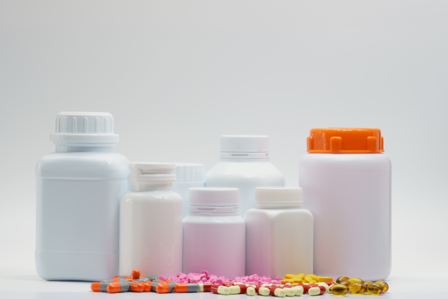 Various types of supplement bottles with child-resistant closures.
