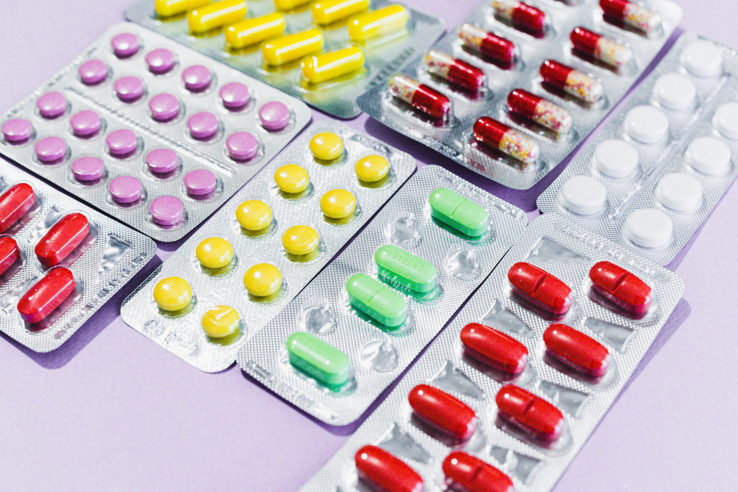 Medications and supplements in blister packaging.