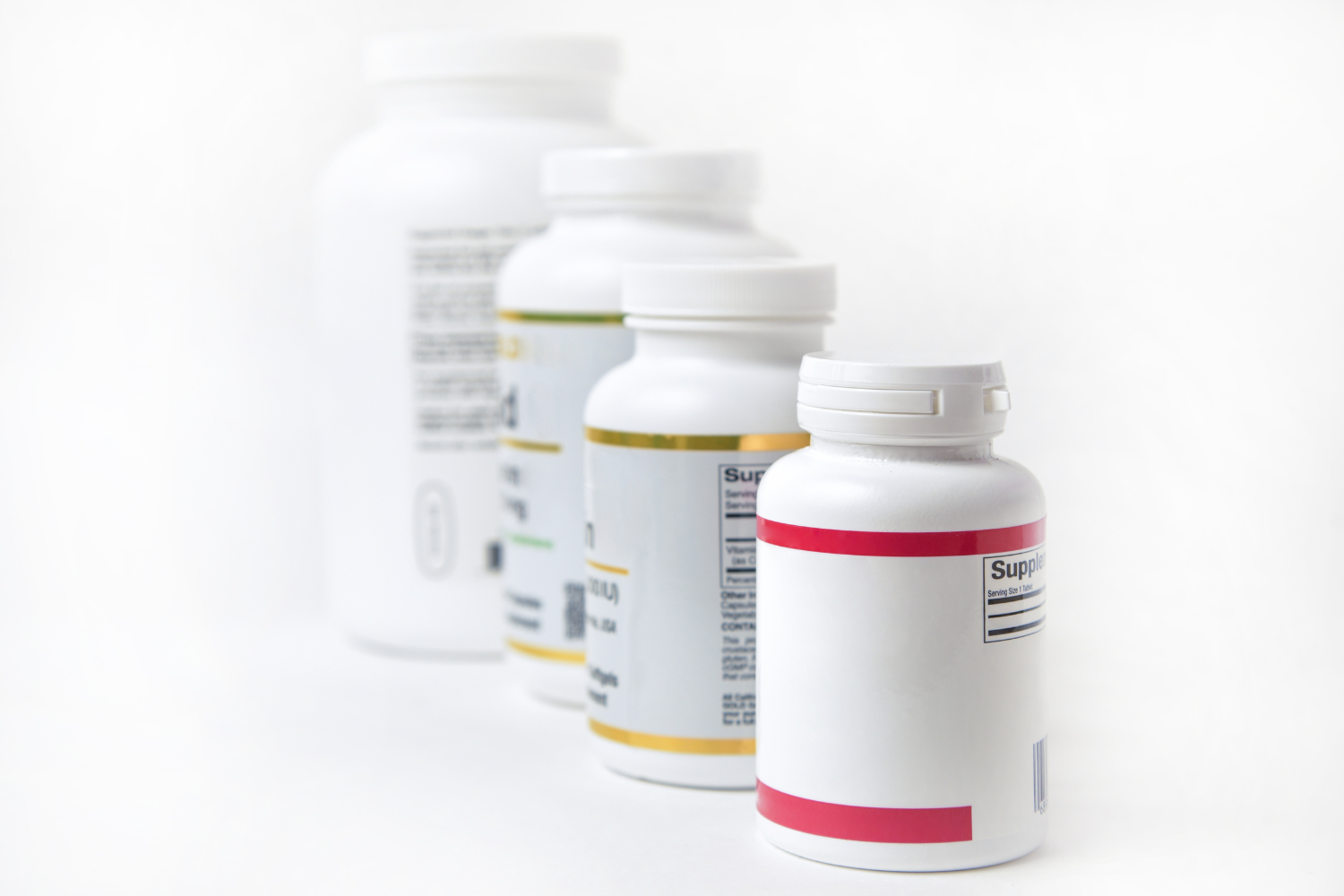 Supplement bottles with labels.
