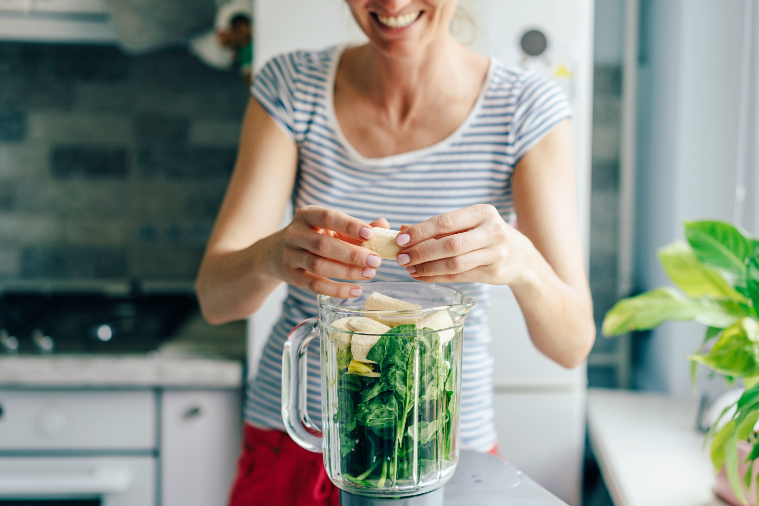 A vegan using the blender.