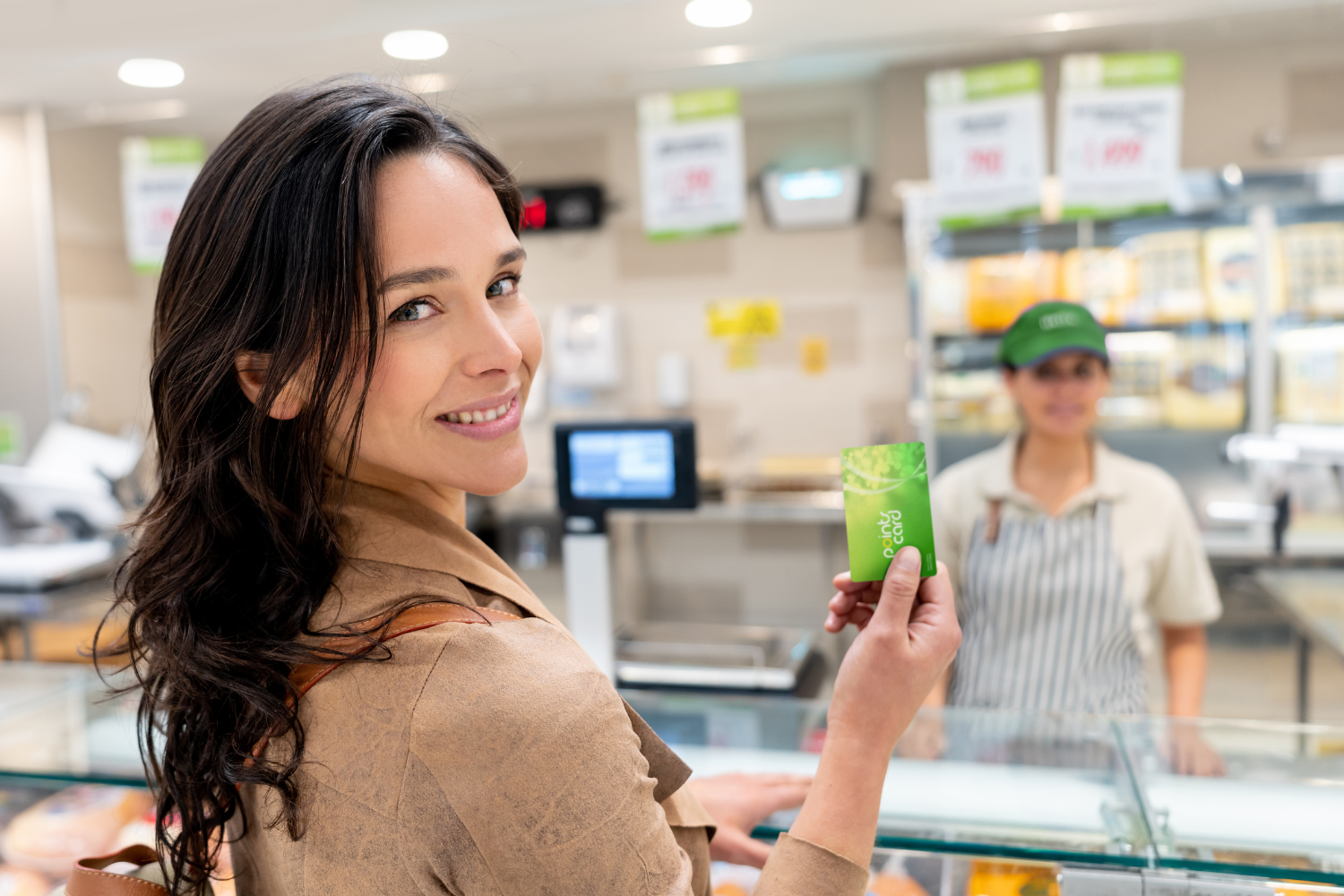 Customer with loyalty card, signifying customer loyalty.