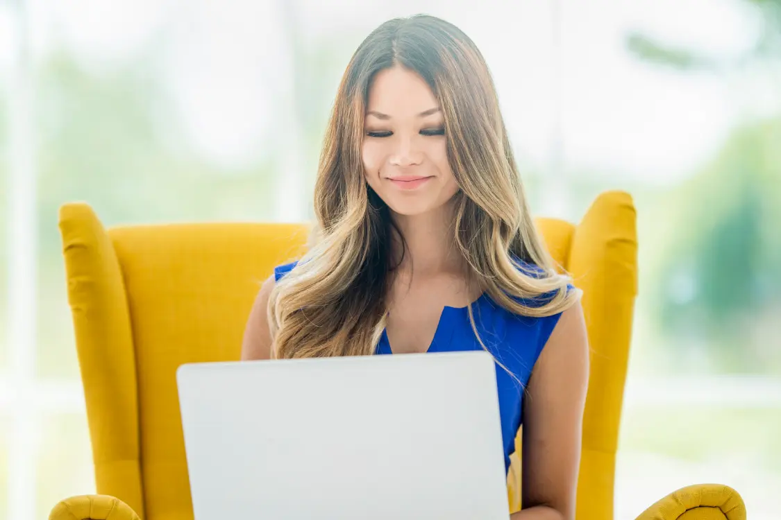 Woman researching supplement manufacturers online