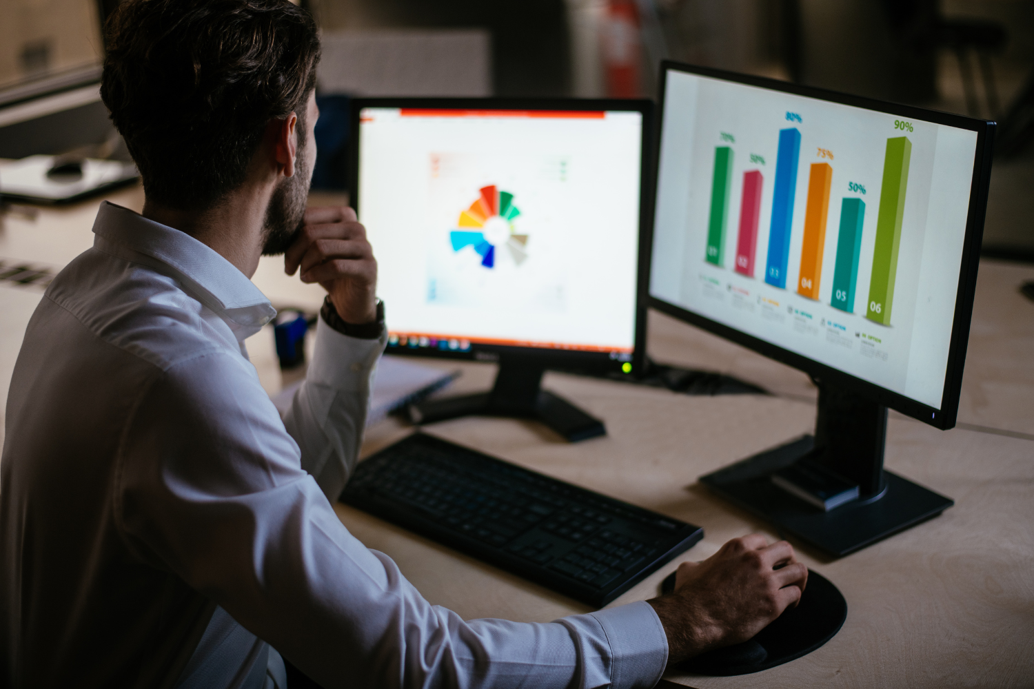 Man looking at marketing charts.