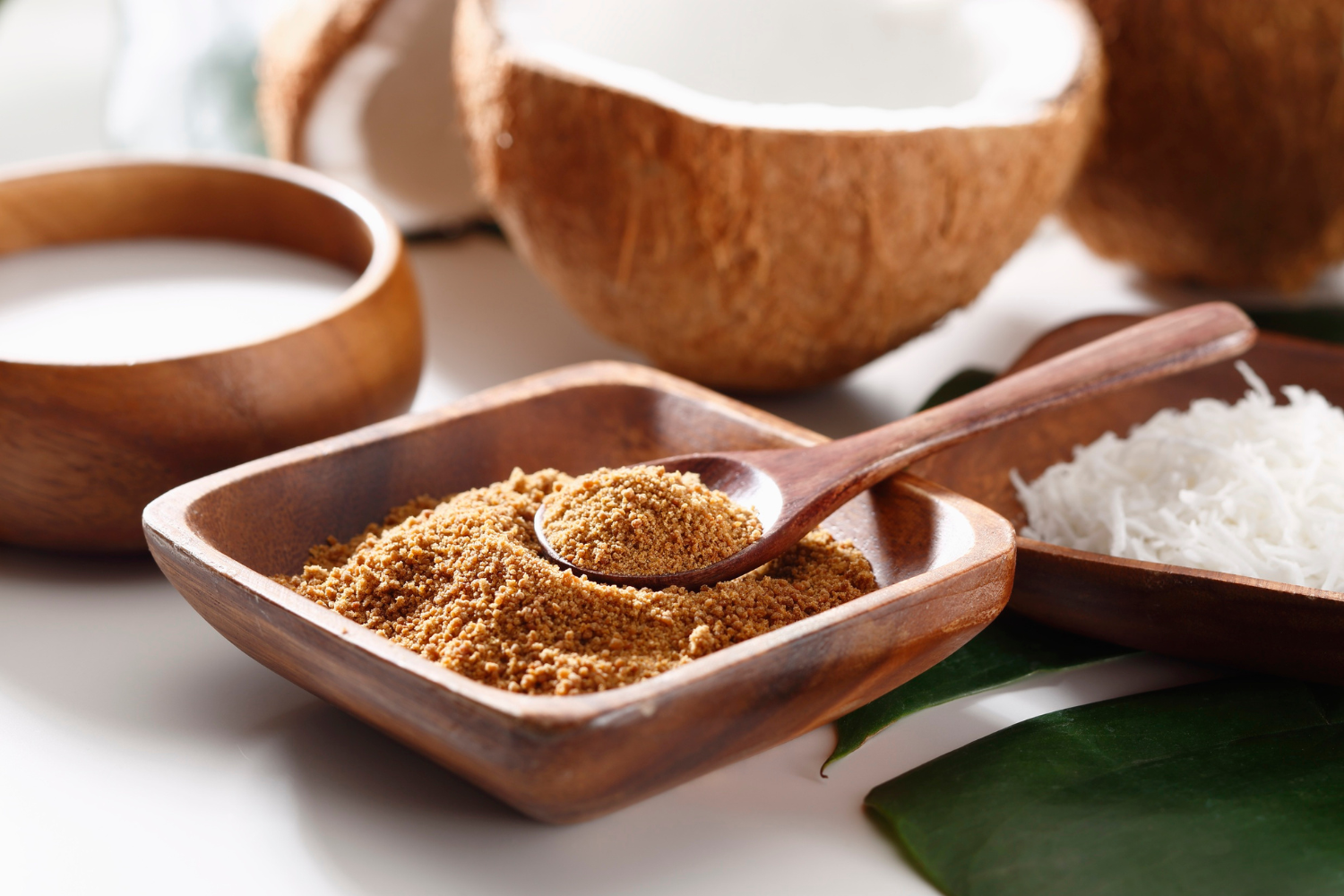 Coconut sugar with coconuts at the back.