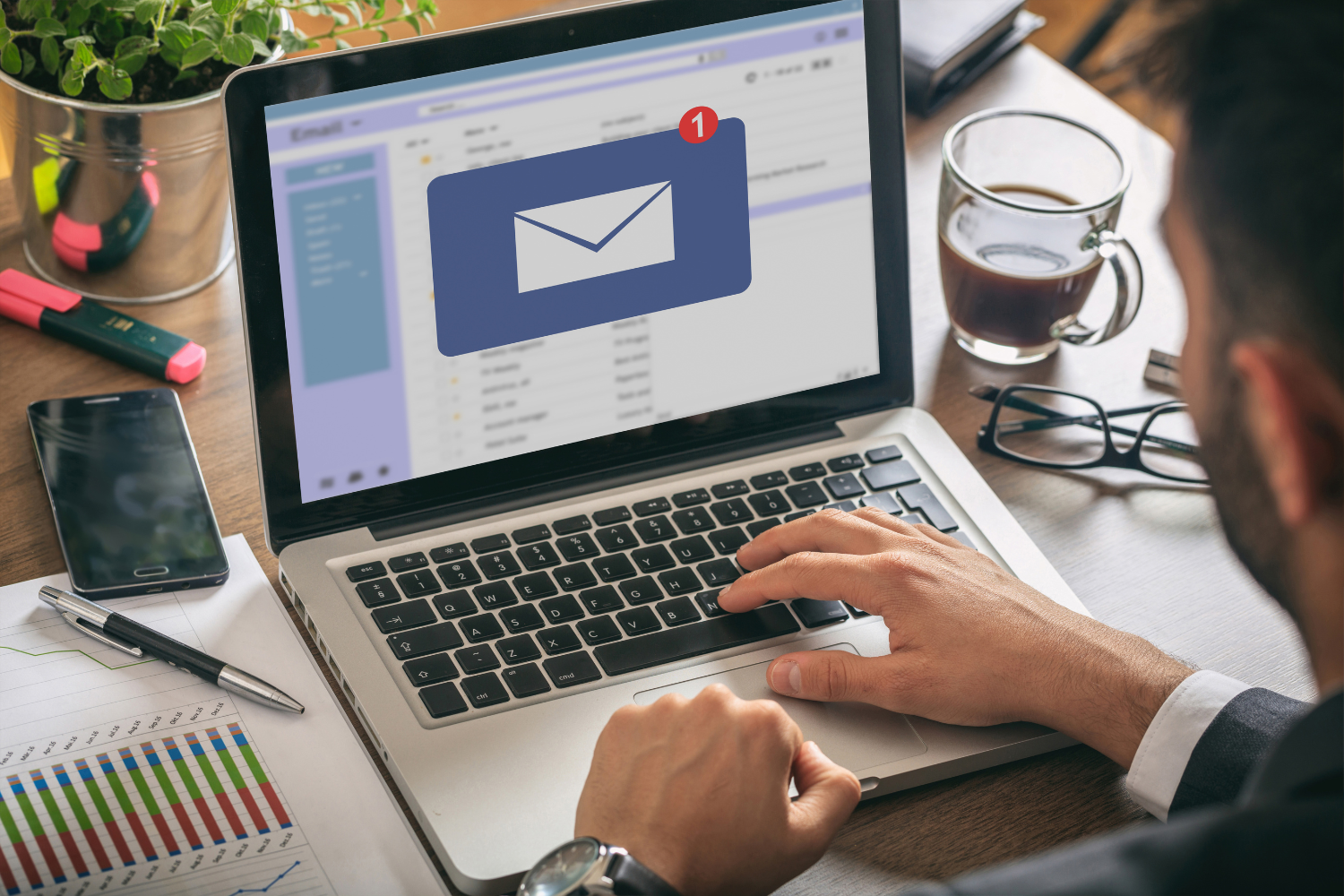 A laptop screen with an email icon.