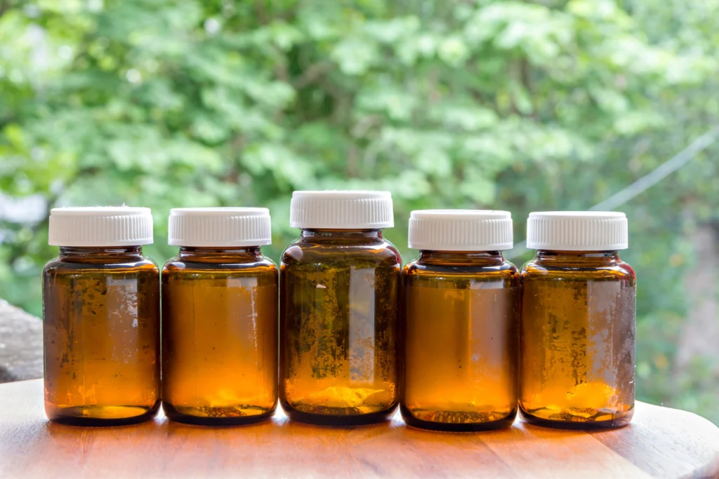 Various recycled supplement bottles.