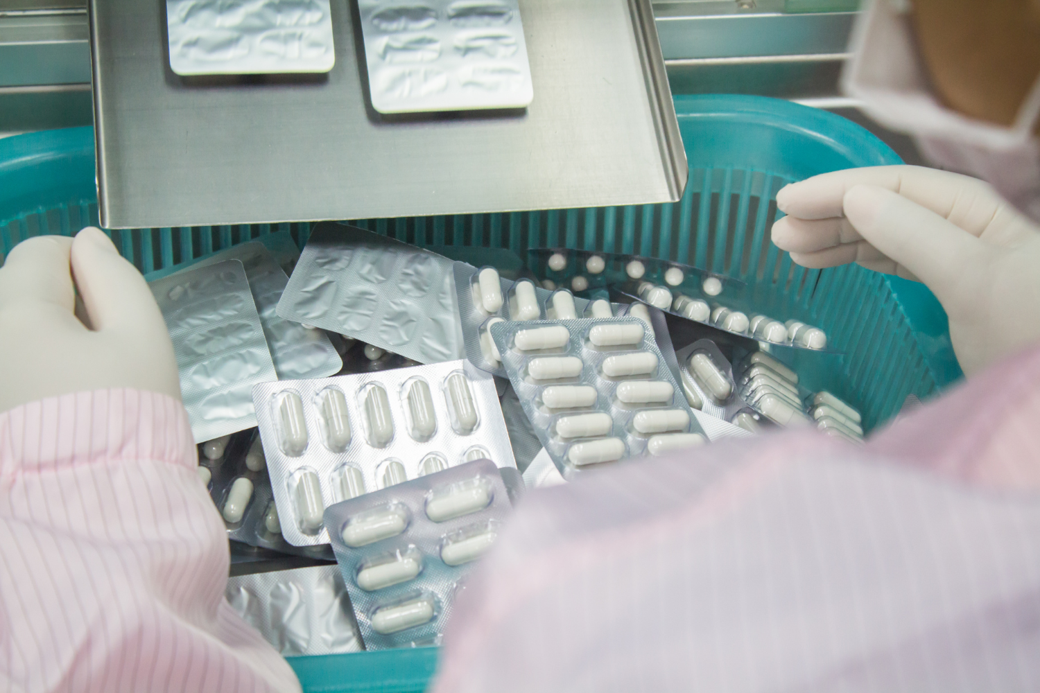 A high-tech supplement manufacturing facility producing capsules.