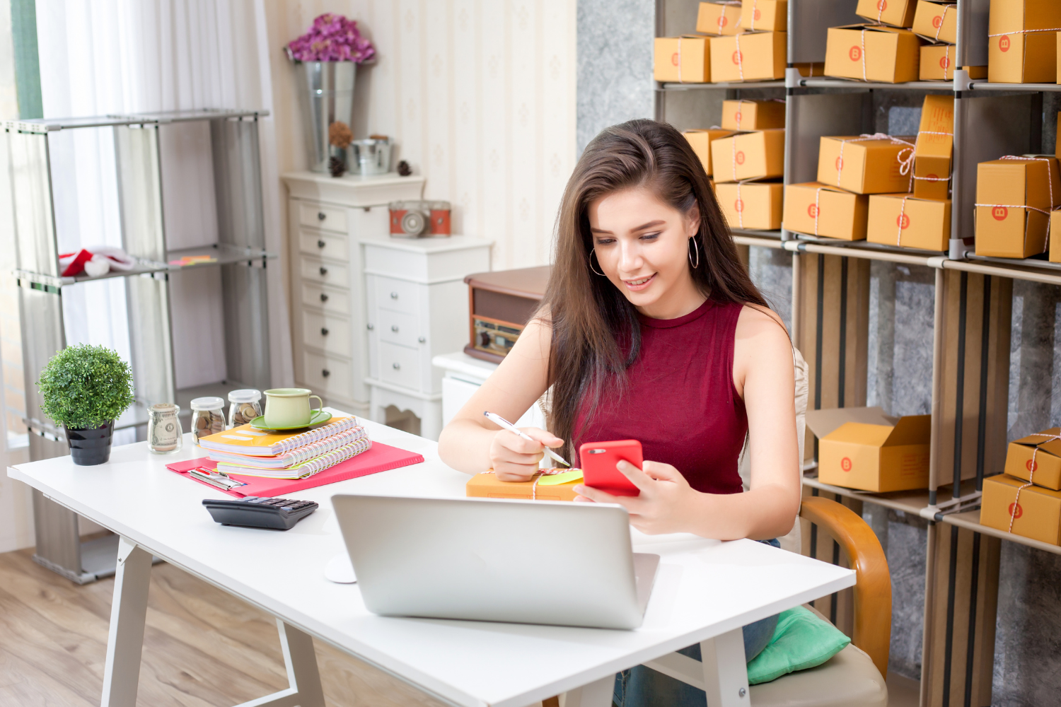 A business owner using a laptop to create an online store.