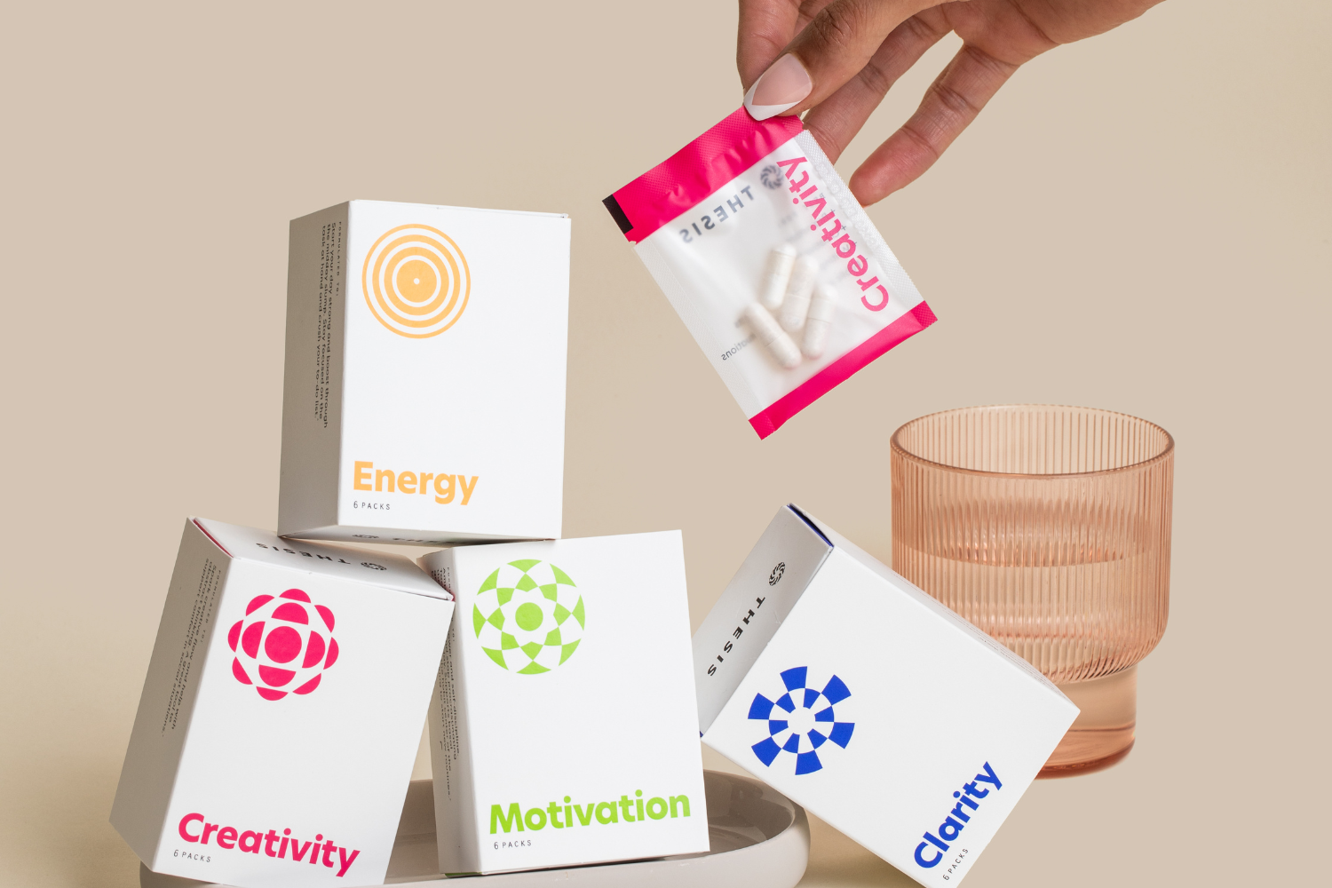 A consumer holding various supplements.