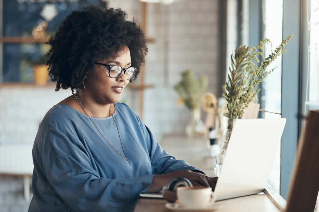 Businesswoman reviewing FDA inspection history supplement manufacturer records on laptop
