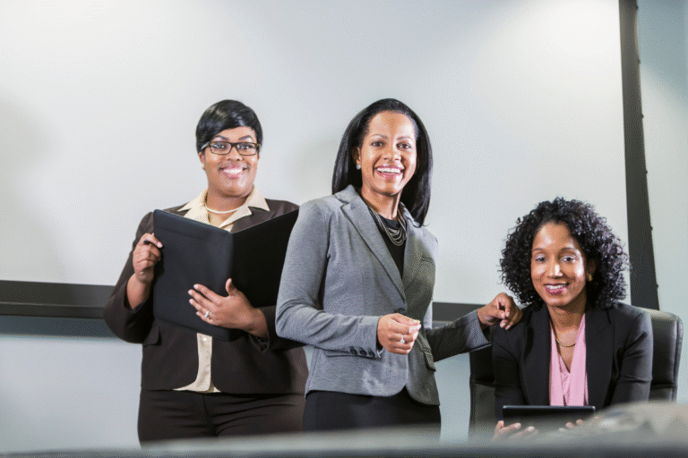 Corporate supplement manufacturer team of professionals smiling in office.