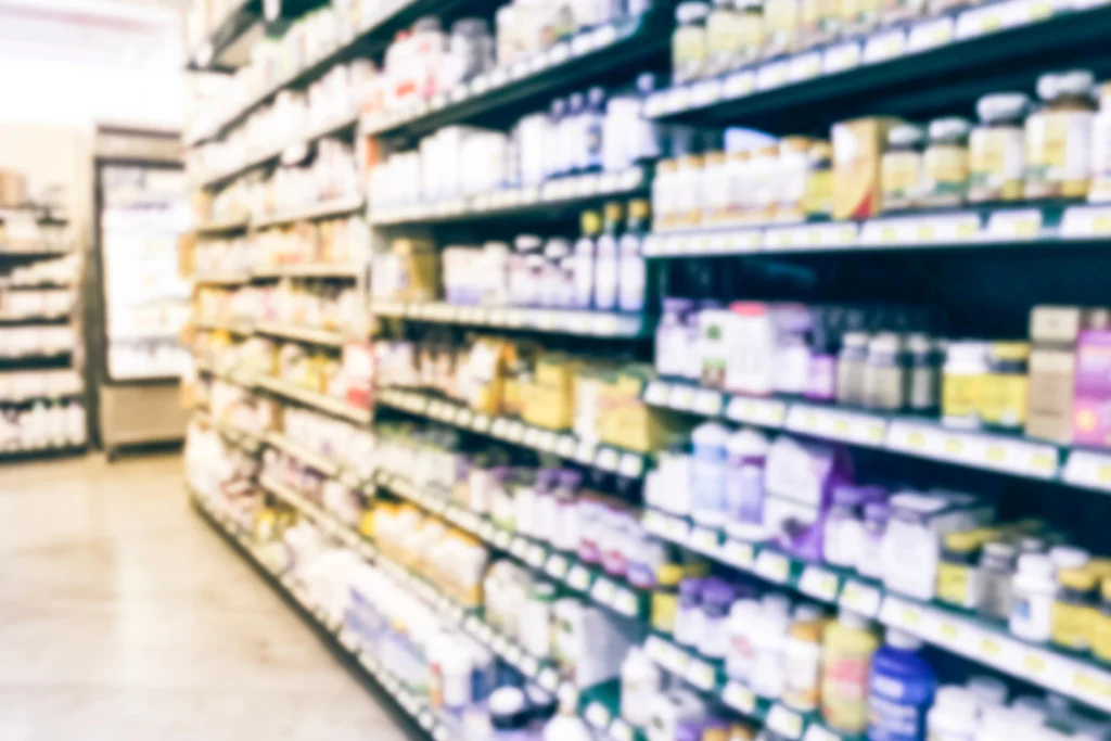 Shelves filled with dietary supplements in a retail store